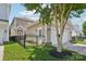 Attached two-car garage on a property in a suburban neighborhood with green grass at 10401 Royal Winchester Dr, Charlotte, NC 28277