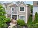 Charming two-story home with a welcoming front porch and a second-story balcony at 10401 Royal Winchester Dr, Charlotte, NC 28277