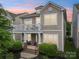 Charming home with a second story balcony, covered front porch, and meticulous landscaping at 10401 Royal Winchester Dr, Charlotte, NC 28277