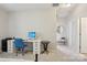 Bright home office with white desk, office chair, and a view to the hall at 10401 Royal Winchester Dr, Charlotte, NC 28277