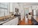 Modern kitchen with stainless steel appliances, granite countertops, and white cabinets at 10401 Royal Winchester Dr, Charlotte, NC 28277