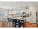 A stylish kitchen featuring a large center island, stainless steel appliances, and a bright breakfast nook at 10401 Royal Winchester Dr, Charlotte, NC 28277