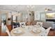 Inviting eat-in kitchen with stainless appliances, breakfast table and chairs, and natural light at 10401 Royal Winchester Dr, Charlotte, NC 28277
