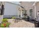 Charming patio with a dining set, grill, and landscaped garden, ideal for entertaining at 10401 Royal Winchester Dr, Charlotte, NC 28277