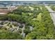 An aerial view of a community surrounded by trees, highways, and a large city skyline at 10616 Back Ridge Rd, Charlotte, NC 28277