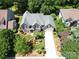 Aerial view of a meticulously landscaped home with a long private driveway at 10616 Back Ridge Rd, Charlotte, NC 28277