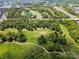 Breathtaking aerial view showcasing green space and walking path nestled near a major highway at 10616 Back Ridge Rd, Charlotte, NC 28277