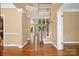 Bright foyer showcasing hardwood floors and a staircase leading to a second level at 10616 Back Ridge Rd, Charlotte, NC 28277