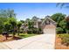 Charming brick home with well-manicured landscaping and a long driveway at 10616 Back Ridge Rd, Charlotte, NC 28277