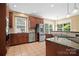Well-equipped kitchen featuring stainless steel appliances, granite countertops, and tile flooring at 10616 Back Ridge Rd, Charlotte, NC 28277