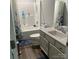 Functional bathroom featuring a vanity, toilet, bathtub, and decorative shower curtain at 1119 Balls Creek Rd, Claremont, NC 28610
