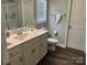 Bathroom features a modern sink, white cabinets, and a glass-enclosed shower at 1119 Balls Creek Rd, Claremont, NC 28610