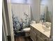 Bathroom featuring a single sink vanity and a shower with a decorative curtain at 1119 Balls Creek Rd, Claremont, NC 28610