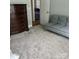 Cozy bedroom features a futon, dresser and plush carpet for a warm and inviting space at 1119 Balls Creek Rd, Claremont, NC 28610