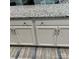 Close up view of the kitchen island with white cabinets and luxurious granite countertop at 1119 Balls Creek Rd, Claremont, NC 28610