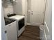 Functional laundry room with modern washer and dryer units at 1119 Balls Creek Rd, Claremont, NC 28610