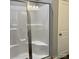 Modern shower behind glass door with built-in seat and bright lighting for comfortable space at 1119 Balls Creek Rd, Claremont, NC 28610