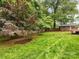 Beautiful backyard features mature trees and lawn, offering a private outdoor setting at 1300 Rutledge Ave, Charlotte, NC 28211