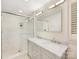 Stylish bathroom with double vanity, marble countertops, and a glass-enclosed shower for a spa-like experience at 1300 Rutledge Ave, Charlotte, NC 28211
