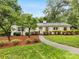 Charming single-story home with a well-maintained front yard, mature trees, and a welcoming walkway at 1300 Rutledge Ave, Charlotte, NC 28211