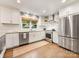 Updated kitchen with stainless steel appliances, white cabinetry and subway tile for a clean aesthetic at 1300 Rutledge Ave, Charlotte, NC 28211
