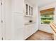 Bright kitchen featuring white cabinets, marble countertops, and hardwood floors for a seamless blend of function at 1300 Rutledge Ave, Charlotte, NC 28211