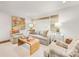 Comfortable living room with a light color palette, woven shades, stylish decor, and an open layout at 1300 Rutledge Ave, Charlotte, NC 28211