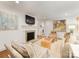 Inviting living room with a fireplace, hardwood floors, stylish decor, and plenty of natural light at 1300 Rutledge Ave, Charlotte, NC 28211