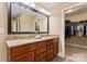 Bathroom featuring double vanity with granite countertop and a walk-in closet at 1328 Huntcliff Dr, Waxhaw, NC 28173