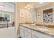 Bathroom with double sinks, granite countertops and framed art at 1328 Huntcliff Dr, Waxhaw, NC 28173