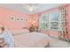 Bright bedroom with two twin beds, a window, and floral curtains at 1328 Huntcliff Dr, Waxhaw, NC 28173