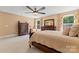 Bedroom showcasing natural light, wooden furnishings, and stylish decor at 1328 Huntcliff Dr, Waxhaw, NC 28173