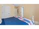Cozy bedroom with bed, open doors, and neutral color scheme at 1328 Huntcliff Dr, Waxhaw, NC 28173