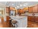Spacious kitchen featuring custom cabinets, granite countertops, stainless steel appliances, and a central island with seating at 1328 Huntcliff Dr, Waxhaw, NC 28173
