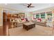 Spacious living room offers a seamless transition to the dining area and modern kitchen at 1328 Huntcliff Dr, Waxhaw, NC 28173