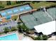 Aerial view of community amenities featuring tennis and pickleball courts and a swimming pool at 1428 Spring Ridge Ln, Denver, NC 28037