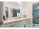 Modern bathroom with quartz counters, white cabinets, and stylish fixtures at 1428 Spring Ridge Ln, Denver, NC 28037