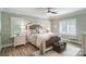Serene bedroom featuring a stylish bed, soft lighting, and comfortable seating area at 1428 Spring Ridge Ln, Denver, NC 28037