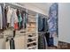 Walk-in closet features custom shelving, hanging rods, shoe racks, and ample storage space for clothing and accessories at 1428 Spring Ridge Ln, Denver, NC 28037