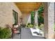 Relaxing covered patio with brick columns and an open wood ceiling offers an inviting outdoor space at 1428 Spring Ridge Ln, Denver, NC 28037