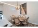 Bright dining room with natural light, neutral paint, and modern furniture at 1428 Spring Ridge Ln, Denver, NC 28037