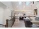 Open-concept living area boasts high ceilings, skylights, and seamless flow into dining and kitchen at 1428 Spring Ridge Ln, Denver, NC 28037