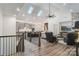 Open-concept living area boasts high ceilings, skylights, and seamless flow into dining and kitchen at 1428 Spring Ridge Ln, Denver, NC 28037