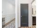 Bright hallway with view of a powder room and a paneled accent wall detail at 1428 Spring Ridge Ln, Denver, NC 28037