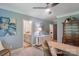 This spacious home office with adjacent bath features modern décor and a large desk at 1428 Spring Ridge Ln, Denver, NC 28037