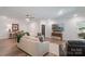 Bright living room offers a comfortable seating arrangement, entertainment center and stylish decor for relaxation at 1428 Spring Ridge Ln, Denver, NC 28037
