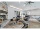 Charming living area featuring a stone fireplace, lots of seating, and seamless flow into a wet bar at 1428 Spring Ridge Ln, Denver, NC 28037