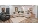 Spacious living room featuring stylish sectional sofa, neutral rug, and hardwood floors at 1428 Spring Ridge Ln, Denver, NC 28037