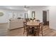 Open-concept living area with hardwood floors, comfortable seating, and a dining area perfect for gatherings at 1428 Spring Ridge Ln, Denver, NC 28037