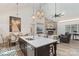 Open concept design connects the living room, dining area, and kitchen, creating a warm, welcoming living space at 1428 Spring Ridge Ln, Denver, NC 28037